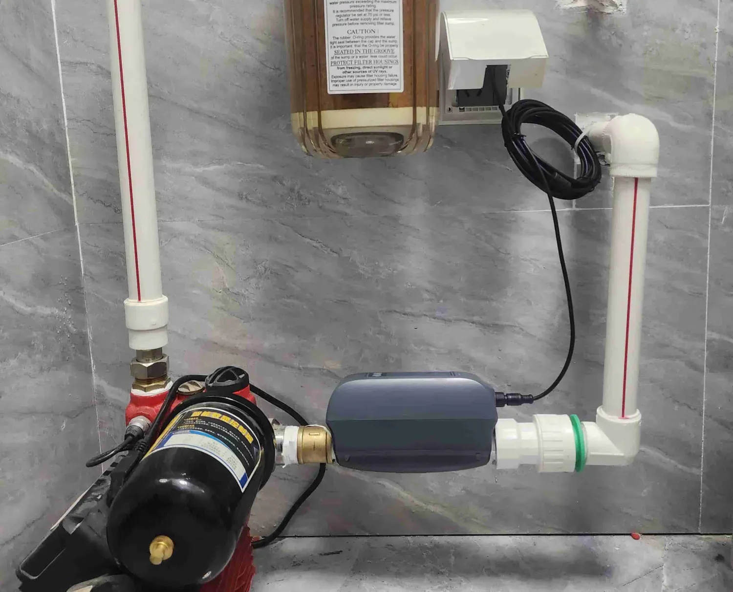 An AquaNet-BD smart water valve in a real utility-room installation context