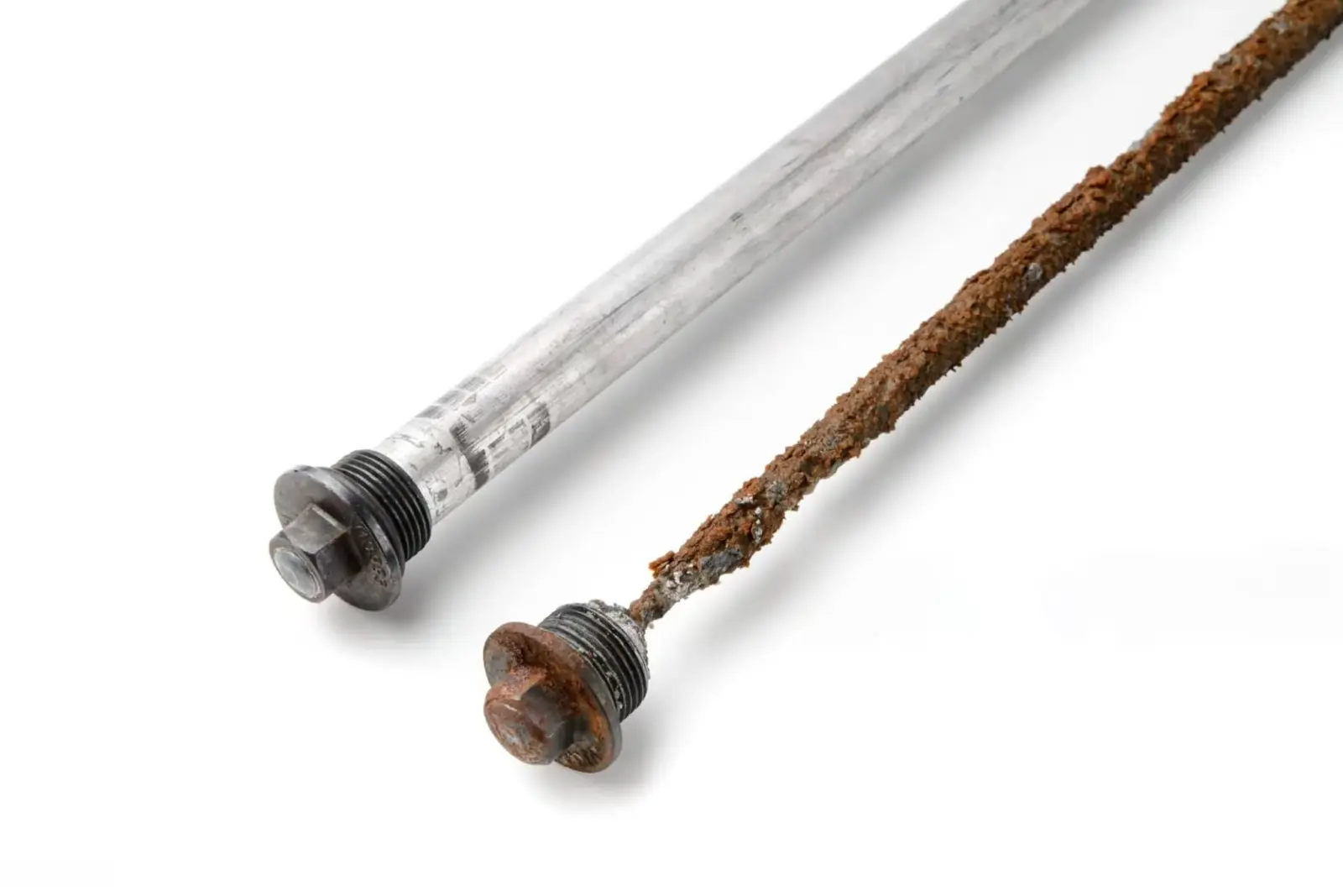 Why Does My House Smell Like Sulfur? (And How to Know If It’s Gas) 1 Worn and new anode rod -