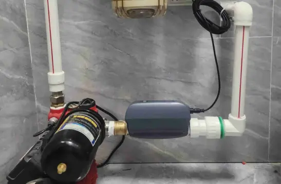 A clean, bright North American home interior showing a main water shutoff valve with a smart automatic valve installed on the pipe by insurance requirement. {{brizy_dc_image_alt imageSrc=